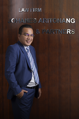 Johanes Eduard Aritonang, S.H., M.H.